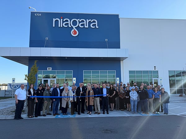 Elsmere Mayor Marty Lenhof prepares to cut the ribbon at the new Niagara Bottling facility | Westside Construction Group