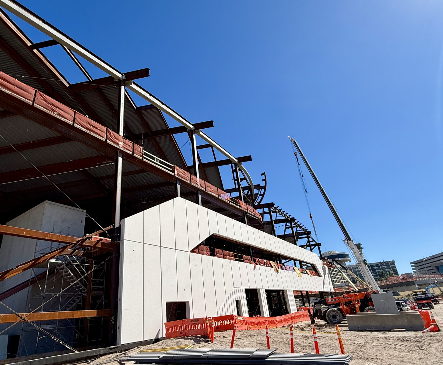 Crane setting a precast concrete exterior panel on the Airside D terminal at Tampa International Airport | Westside Construction Group
