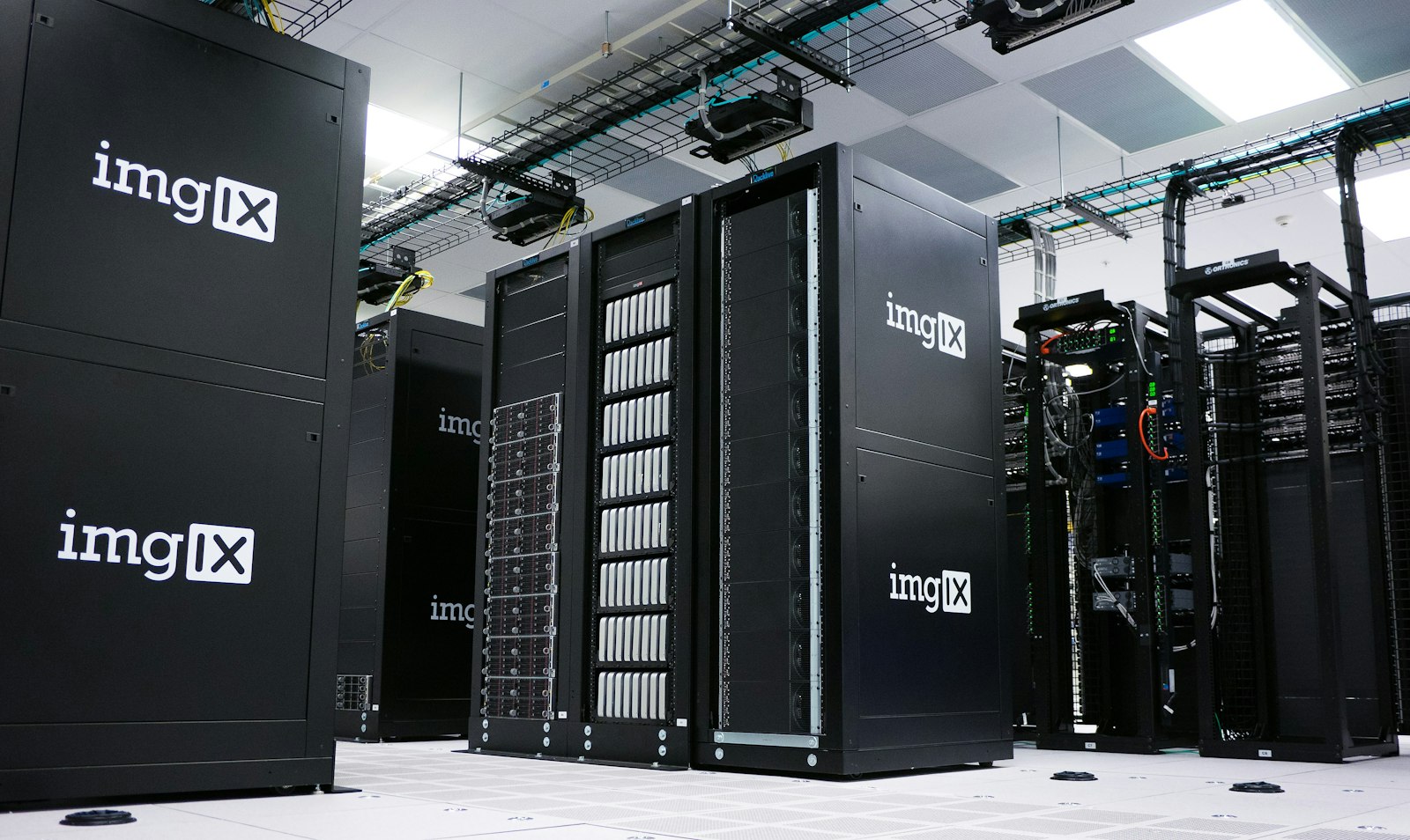 Rows of black server racks inside a data center | Westside Construction Group
