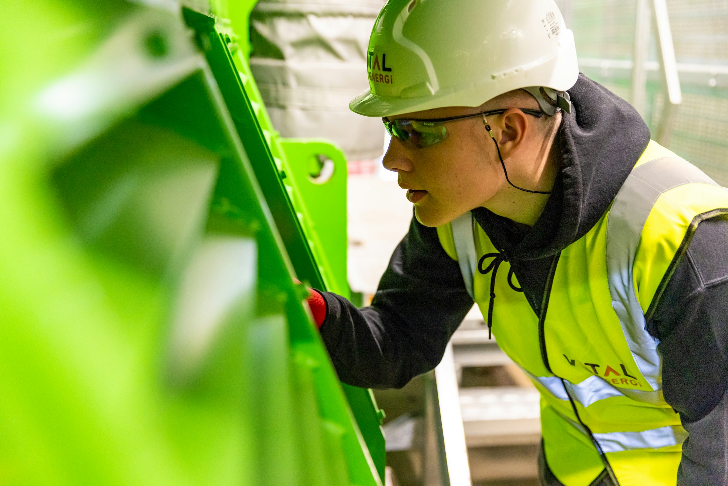 Worker in hard hat and safety gear inside a facility | Westside Construction Group