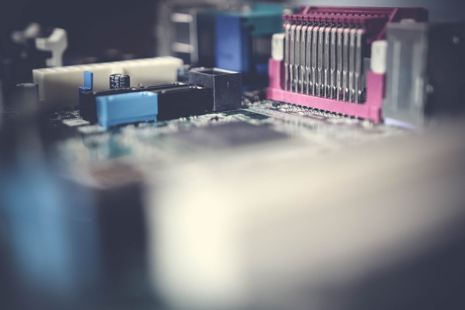 Close-up of integrated circuits and passive components on a printed circuit board