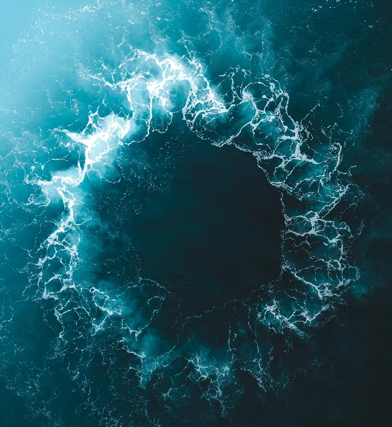 Aerial view of a swirling ocean current