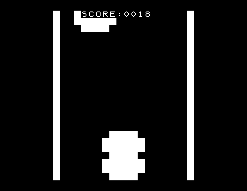 Race gameplay on the Tatung Einstein, steering a car on a scrolling track