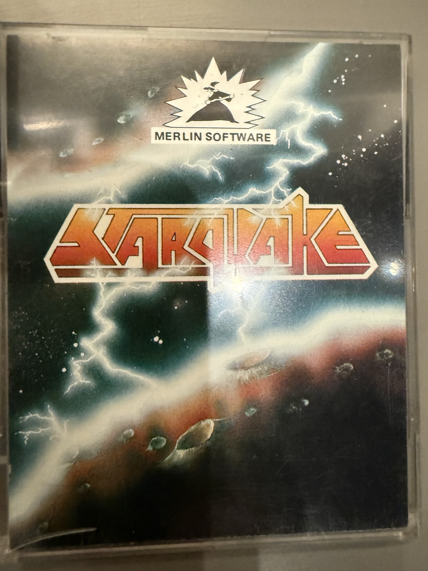 Front of the Starquake case: Merlin Software wizard logo above the Starquake title over a lightning-struck planet