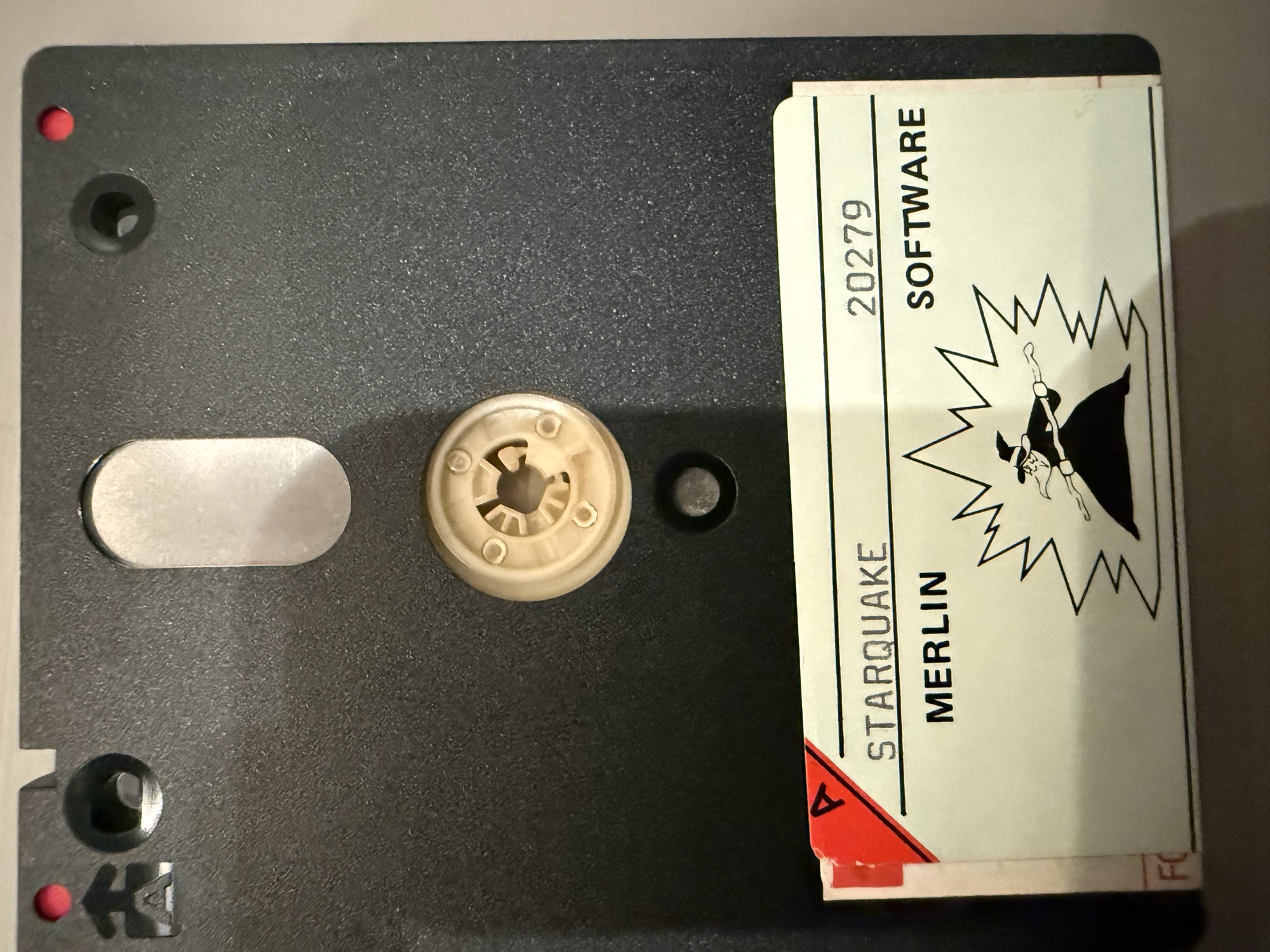 Side A of the 3 inch disc with a Merlin Software label reading Starquake 20279