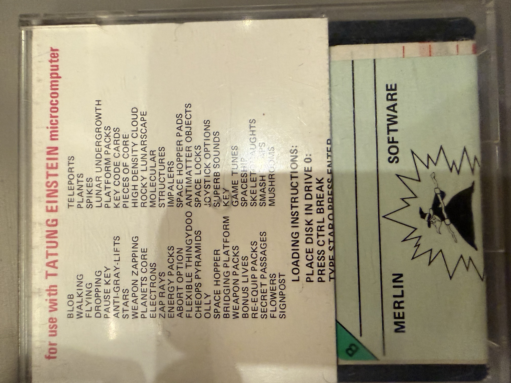 Back of the Starquake case showing the feature list and loading instructions through the clear case, with the side B disc label below