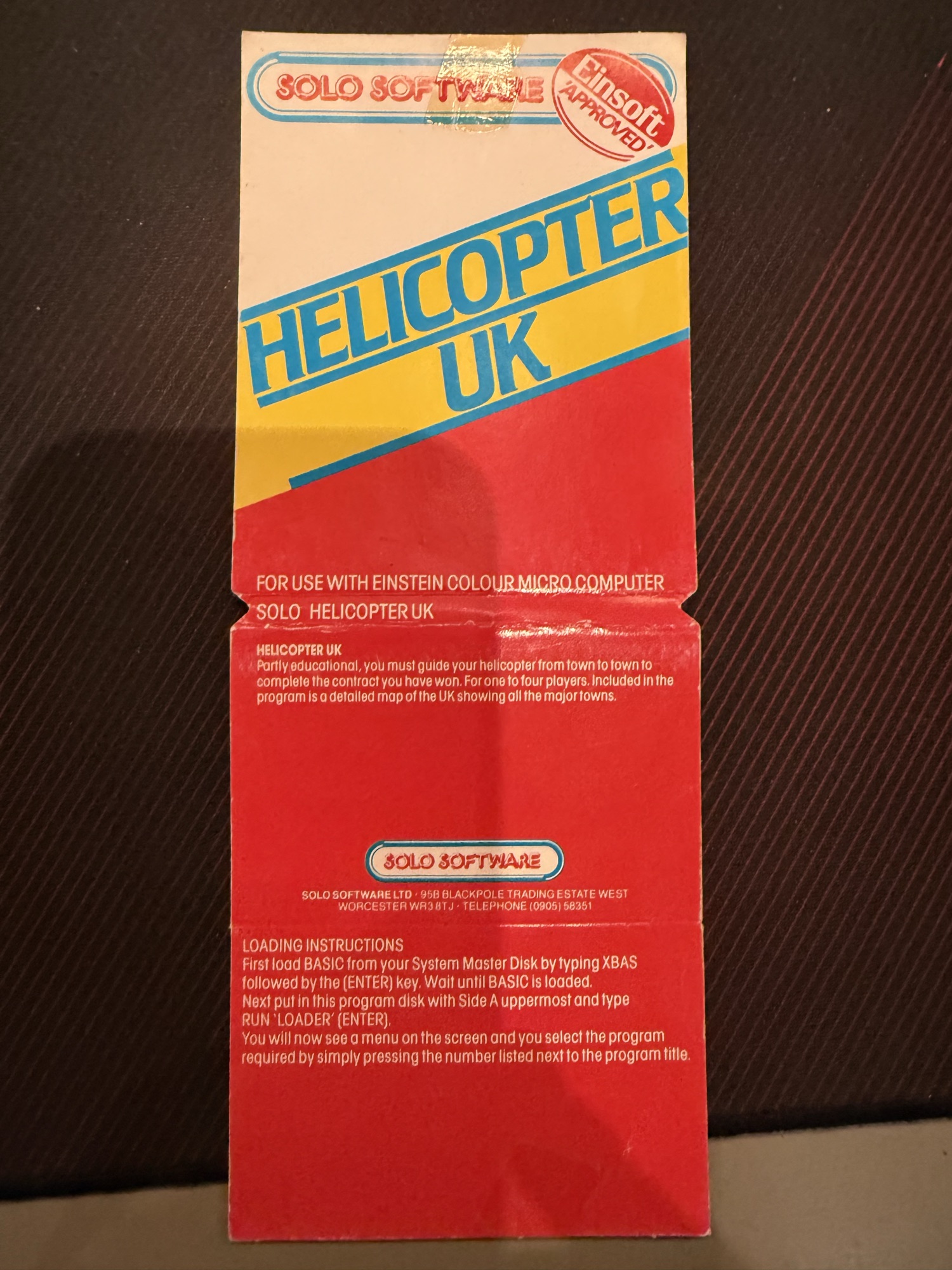 The inlay opened out, with description and loading instructions