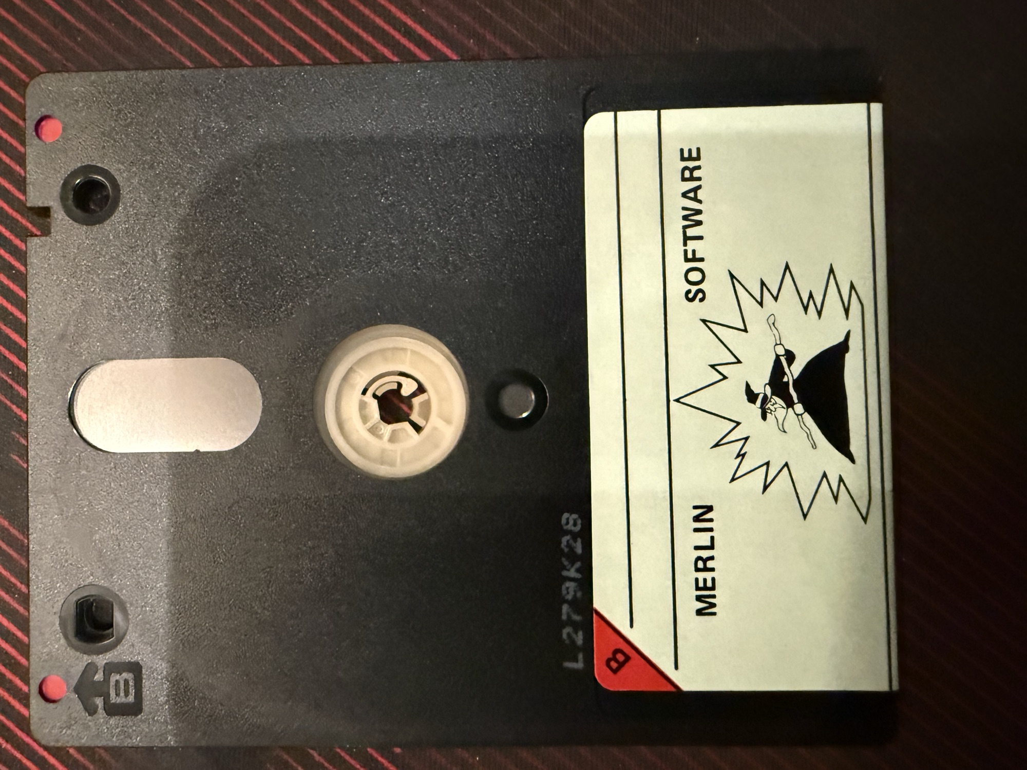 Side B of the disc, a blank Merlin Software label