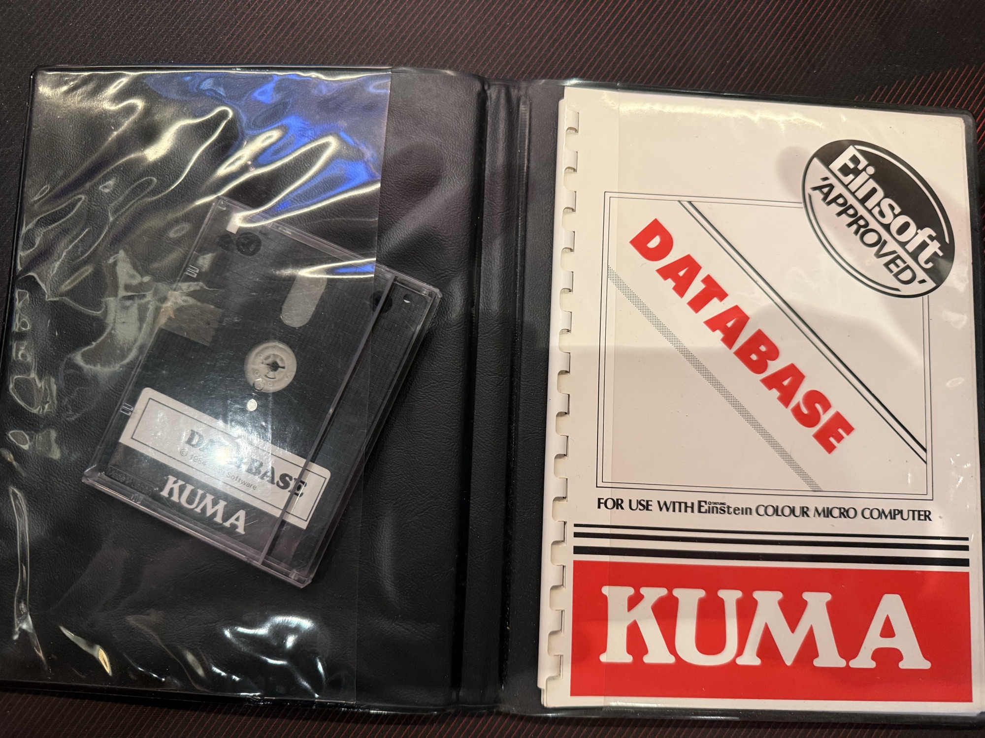 The case open, with the disc and the manual