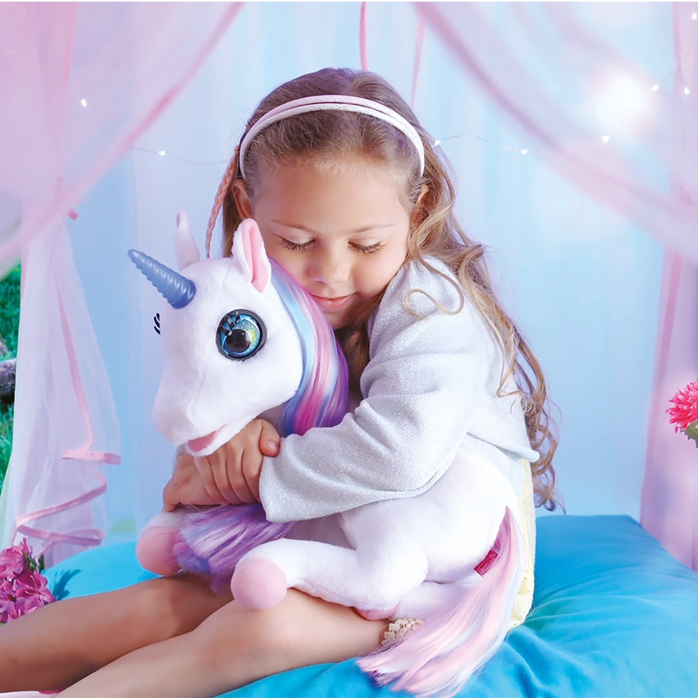 White plush unicorn toy with blue horn, big eyes, pink hooves, and purple mane and tail lying down.