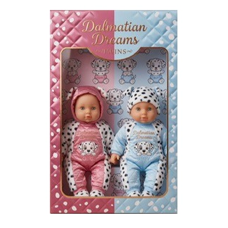 Two baby dolls dressed in pink and blue Dalmatian-themed outfits in a pink and blue box labeled Dalmatian Dreams.