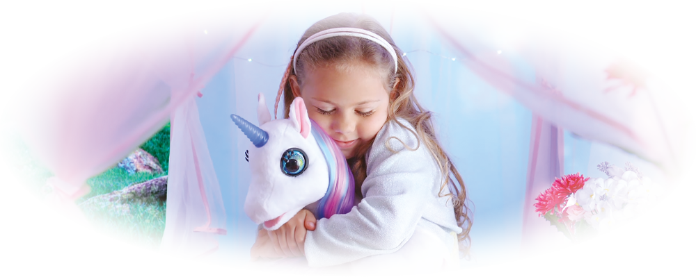 White plush unicorn toy with blue horn, big eyes, pink hooves, and purple mane and tail lying down.