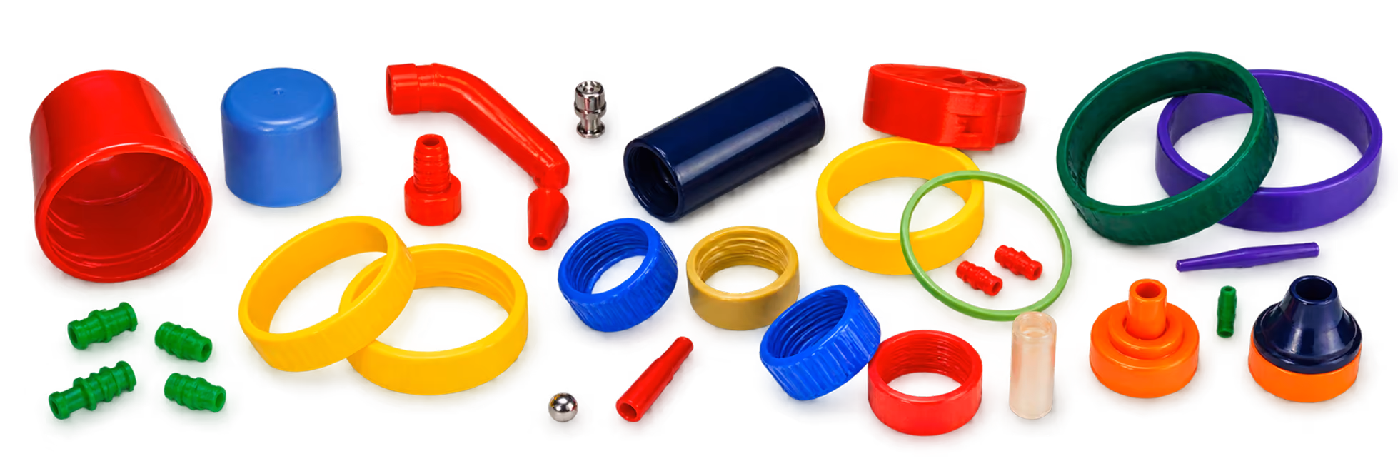 Assortment of colorful plastic and metal rings, caps, connectors, and small parts in red, blue, yellow, green, orange, purple, and white arranged on a black background.