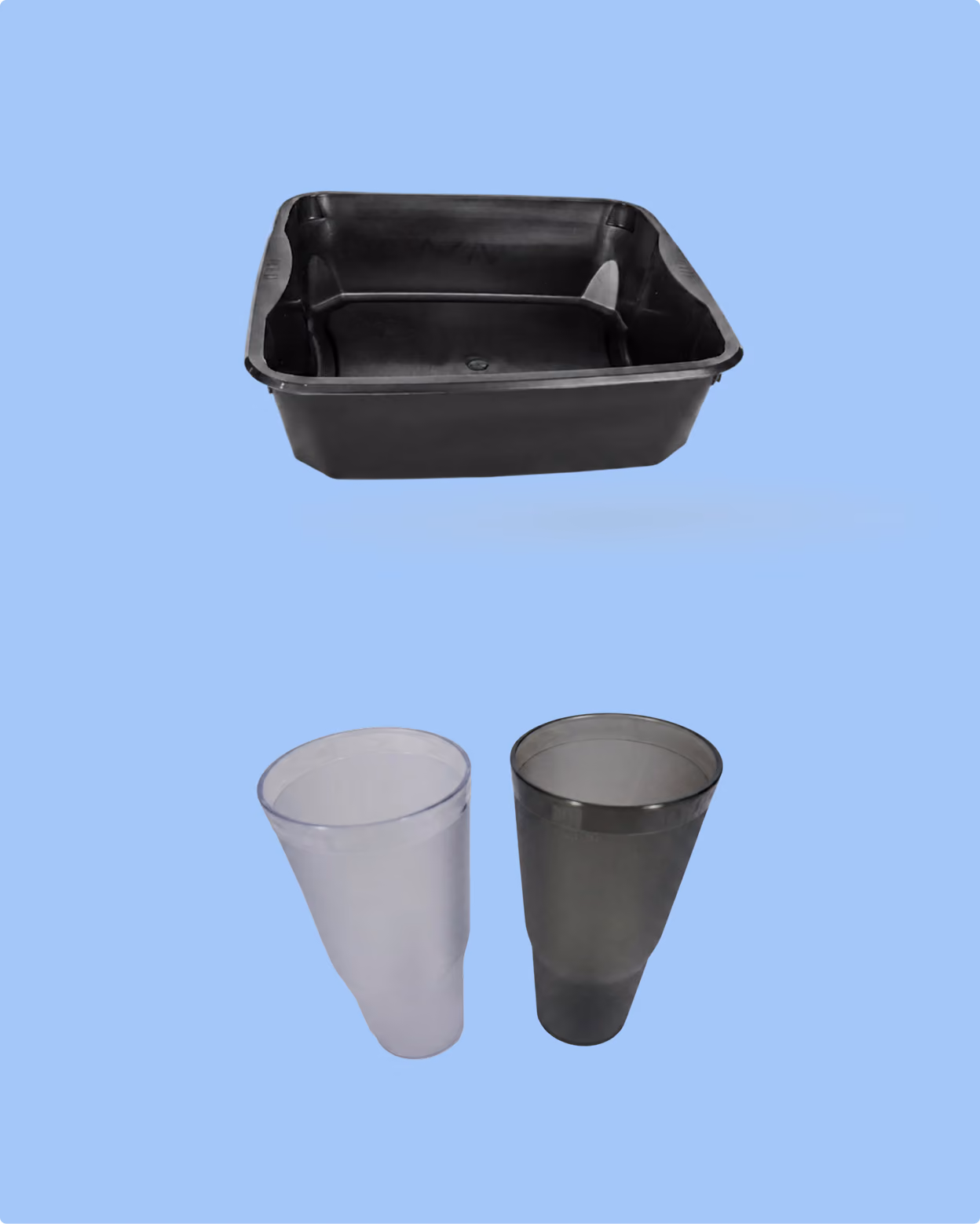 One black square plastic container and two conical plastic cups, one translucent white and one translucent black, on a light blue background.