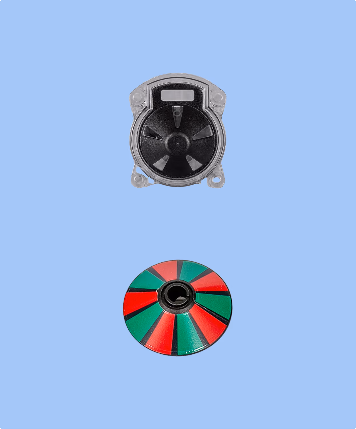 Two circular electronic components on a light blue background, the top one is gray and black with a central axis and three wing-like structures, the bottom one is multicolored with alternating red and green sections radiating from a central black hub.