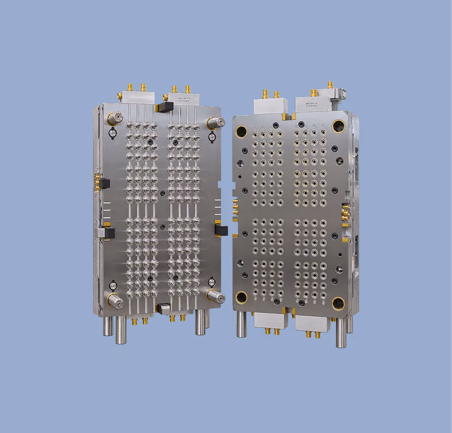 Two metal injection molds with multiple identical cavities, showing the front and back sides against a solid blue background.