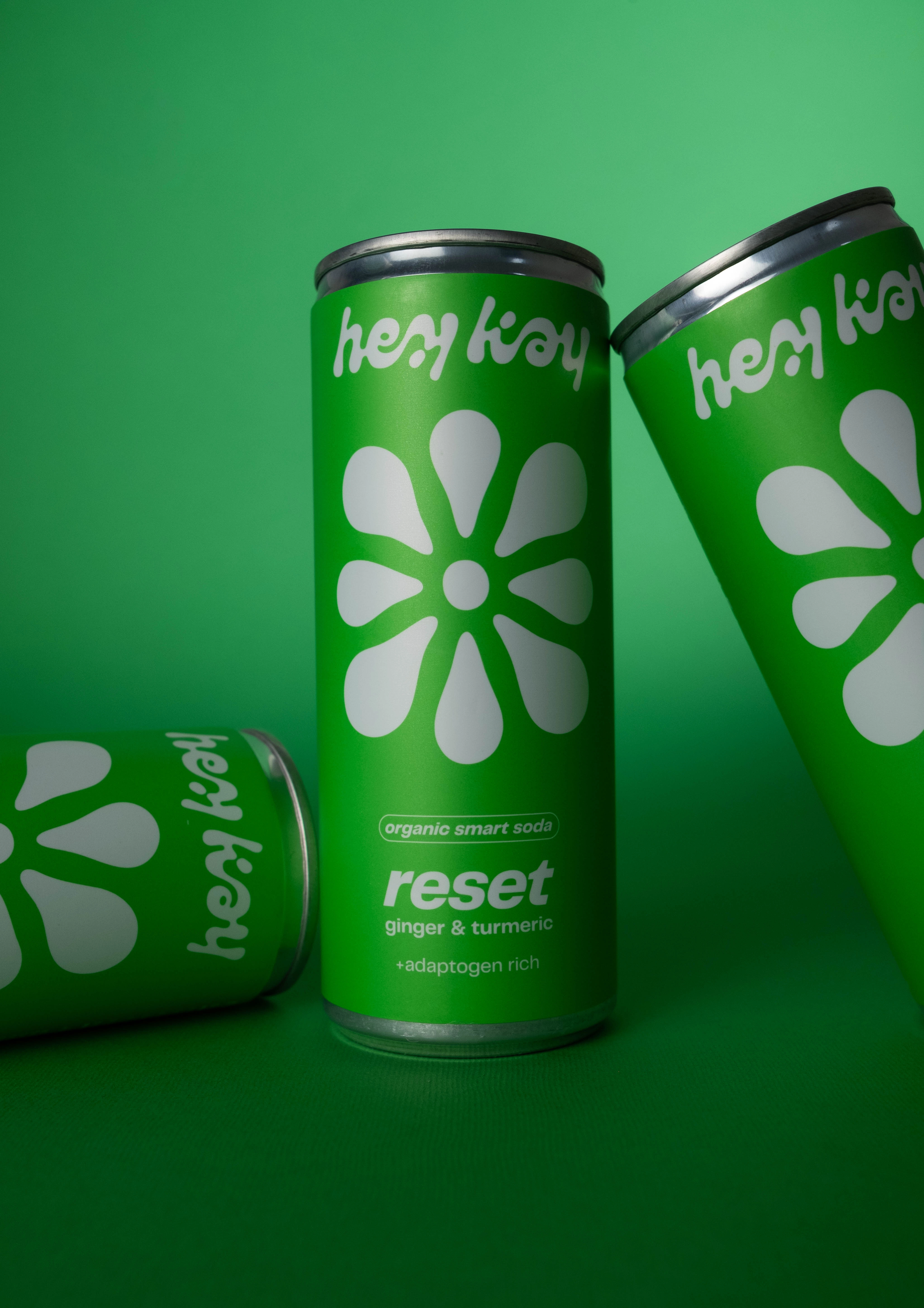 Close-up of a hey kay reset can, with another lying in front