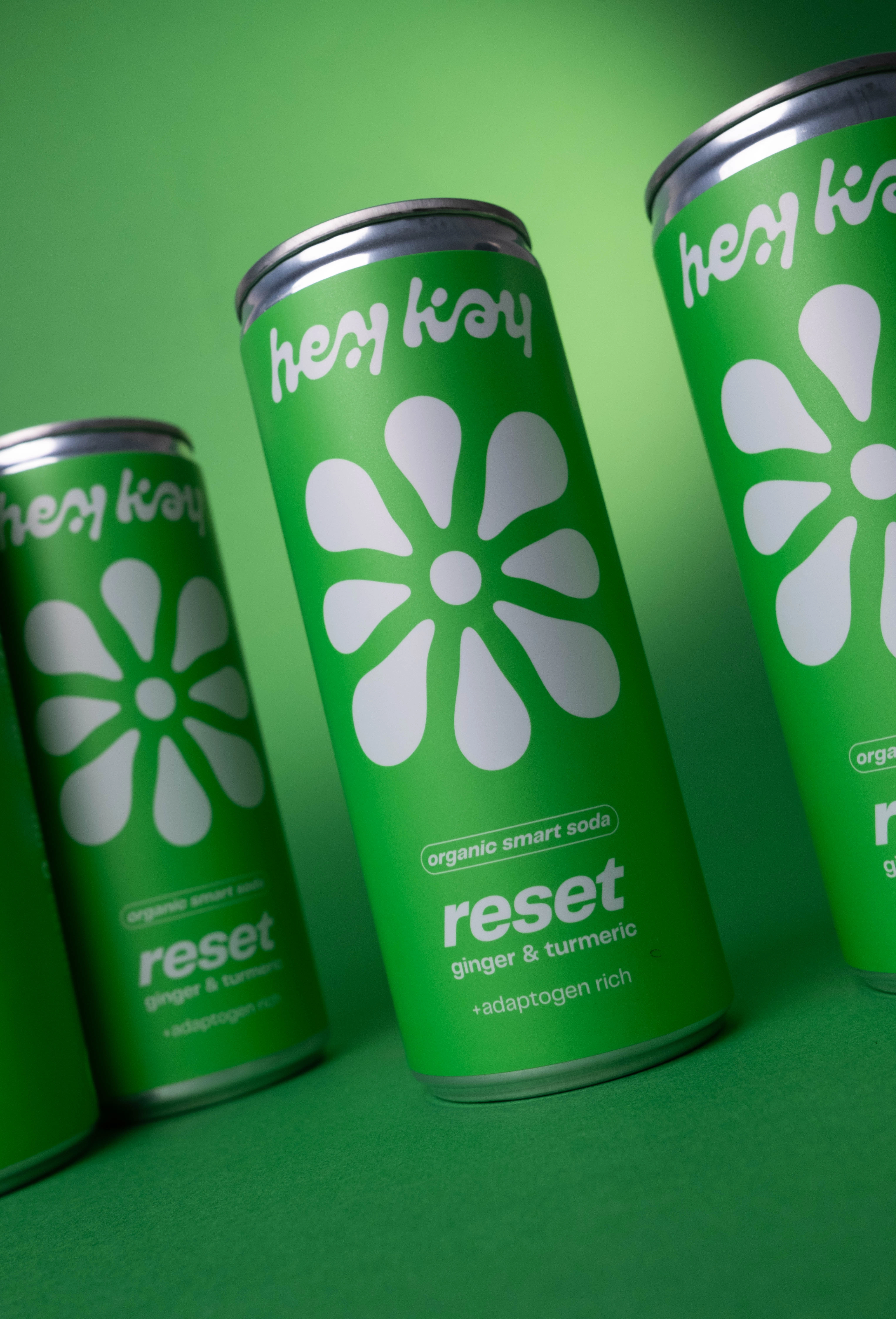 Close-up of tilted hey kay reset cans