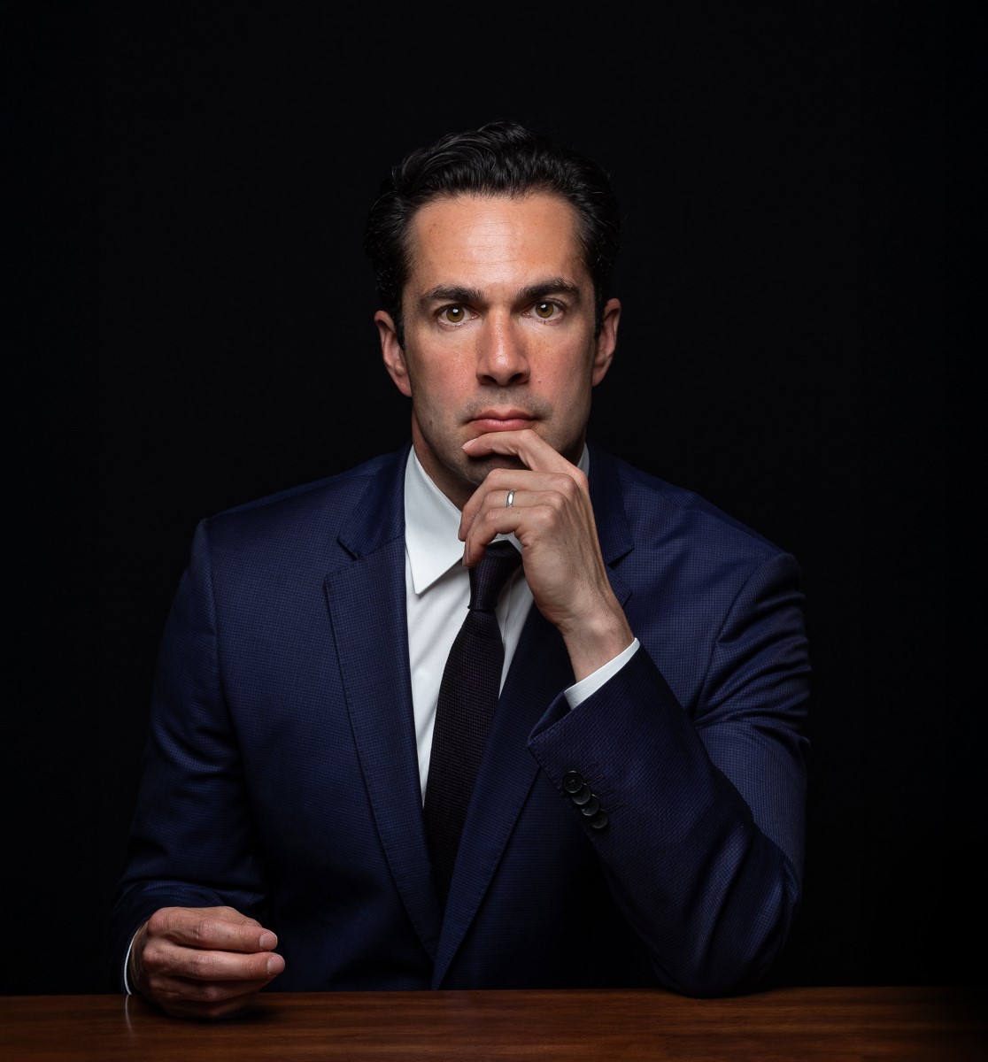 Marco Crawford, professional lawyer and attorney, in thoughtful business portrait pose