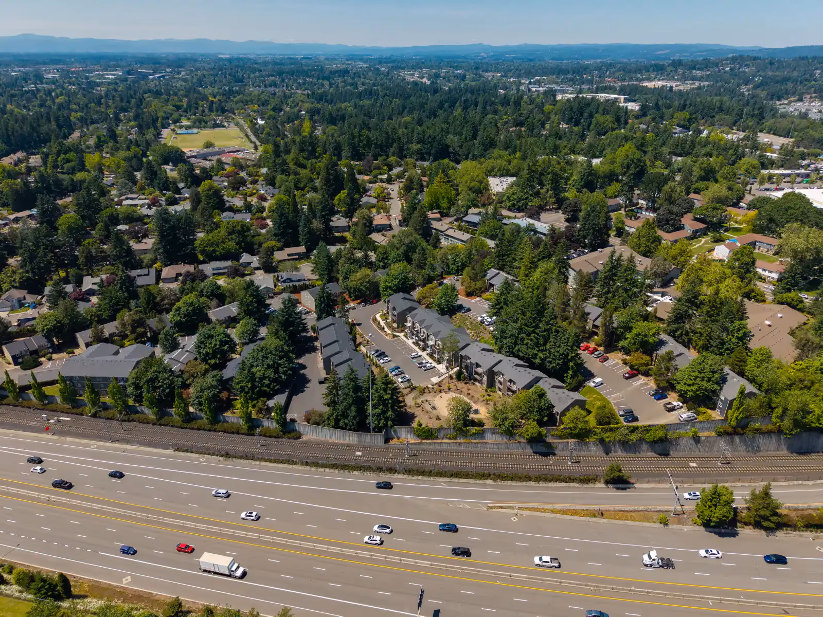 Aerial view of apartments and highway