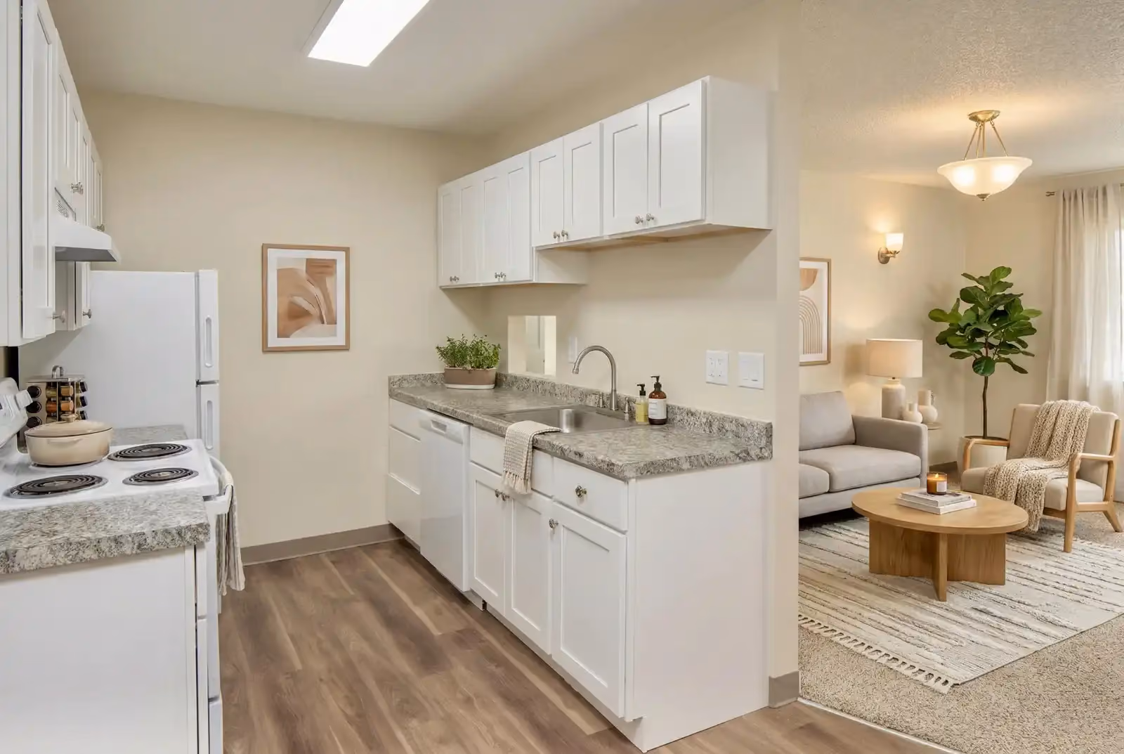 Furnished kitchen with view of living room