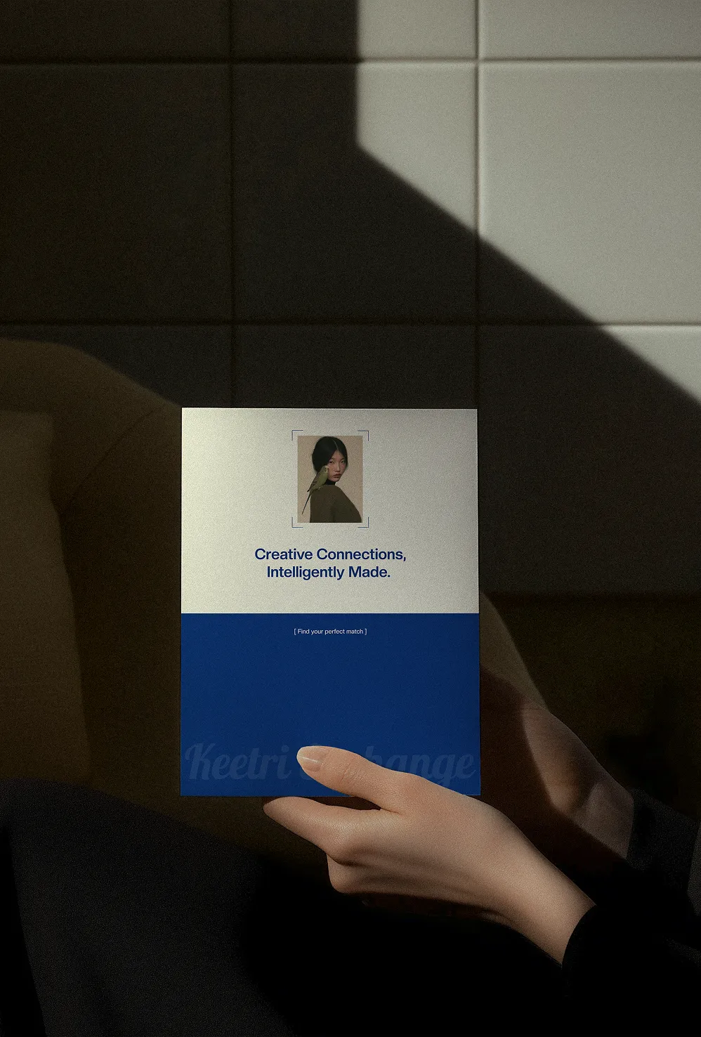 Hand holding a Keetri Exchange print card reading 'Creative Connections, Intelligently Made'