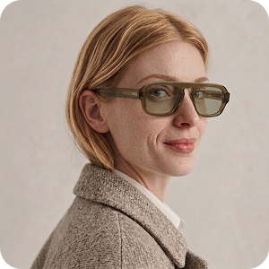 Portrait of a woman wearing glasses and a wool coat