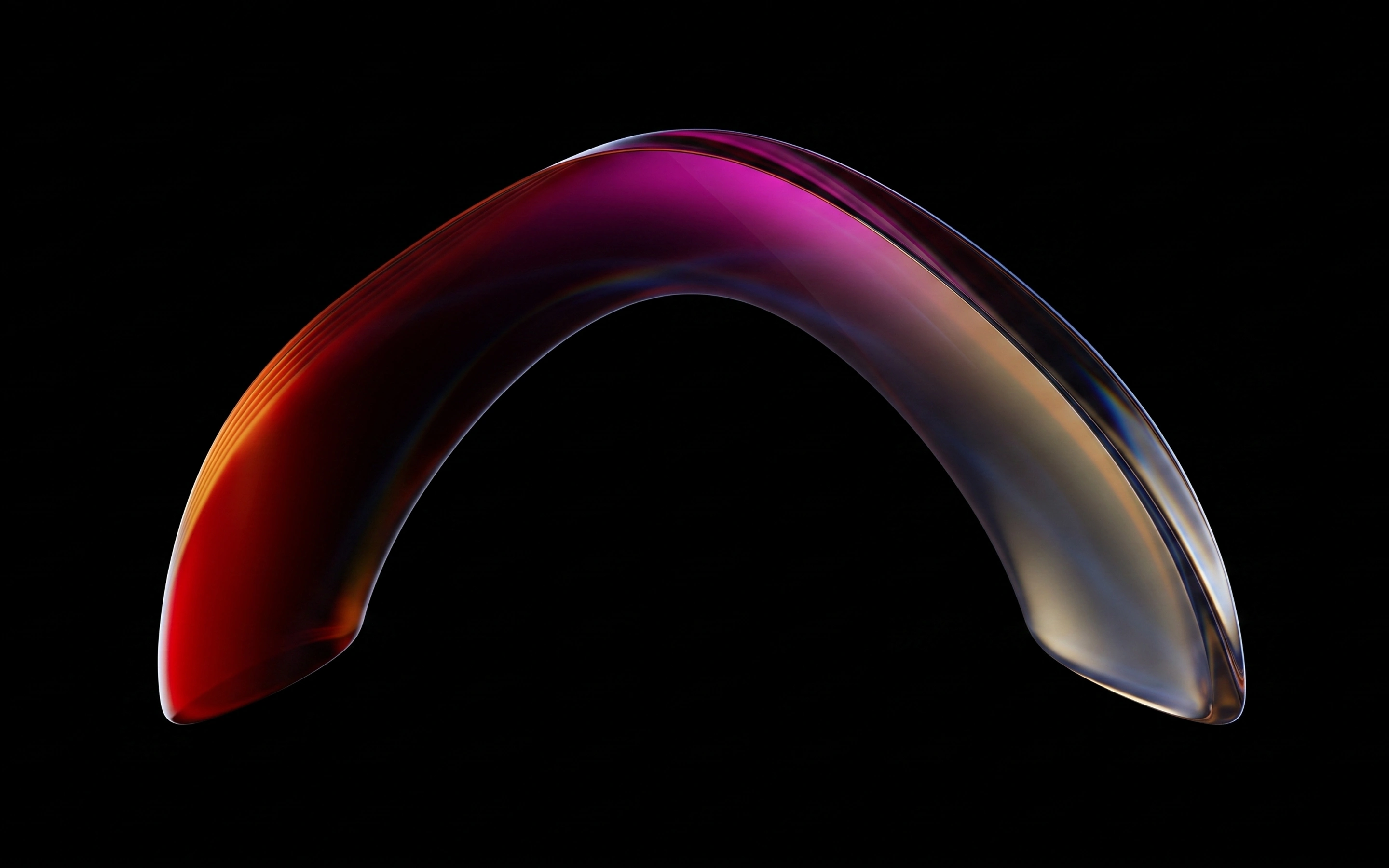 Curved translucent sculpture with smooth surface, glowing with gradient colors from deep red on the left to purple and golden tones on the right, set against a black background.