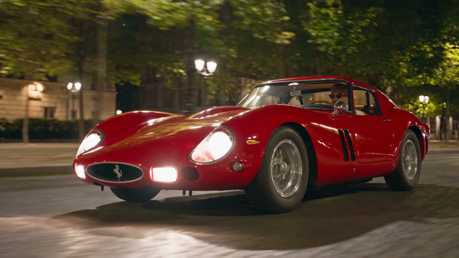 Red Ferrari 250 GTO on a Paris street at night