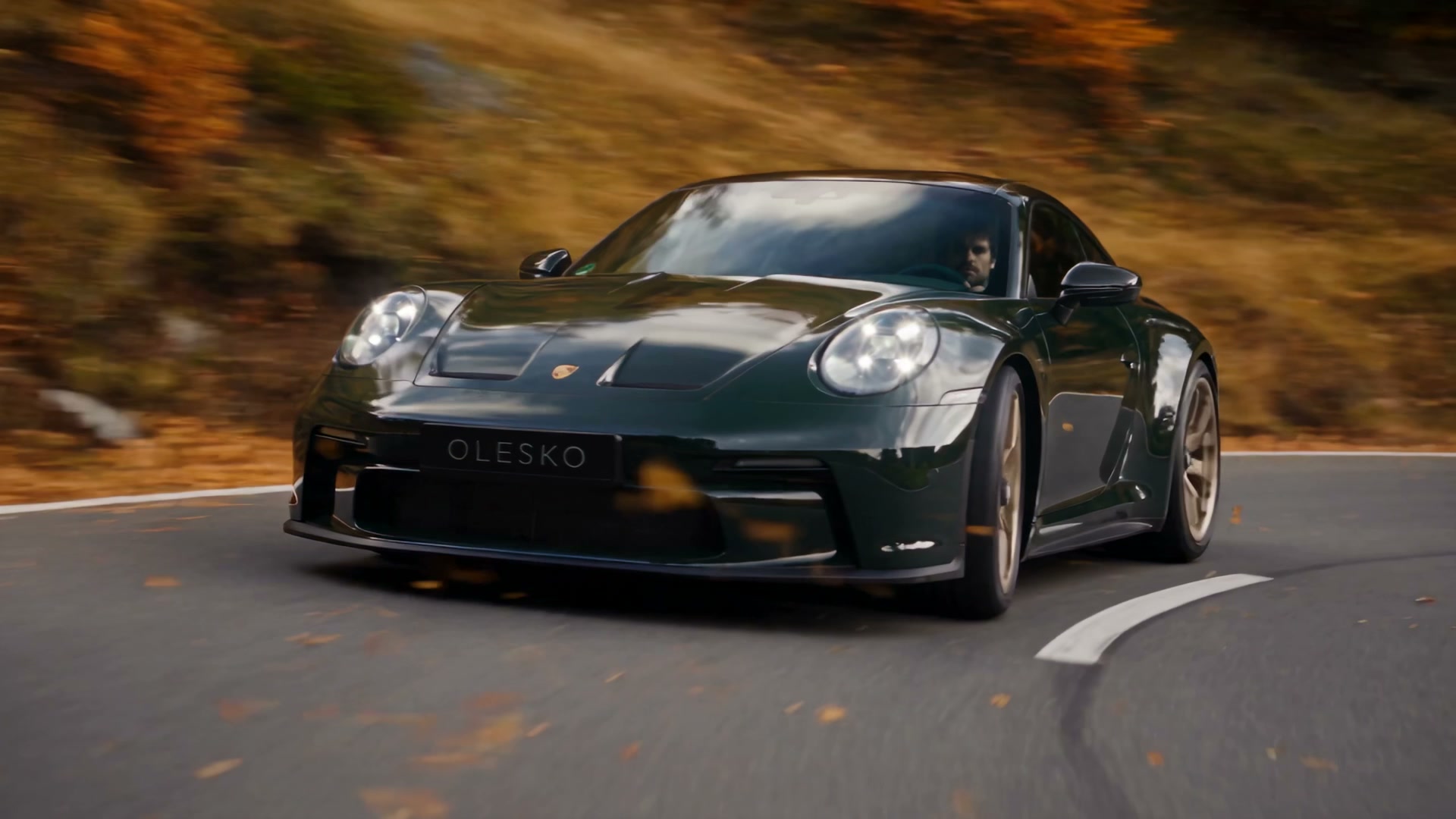 Porsche 992 GT3 Touring on an alpine autumn high pass