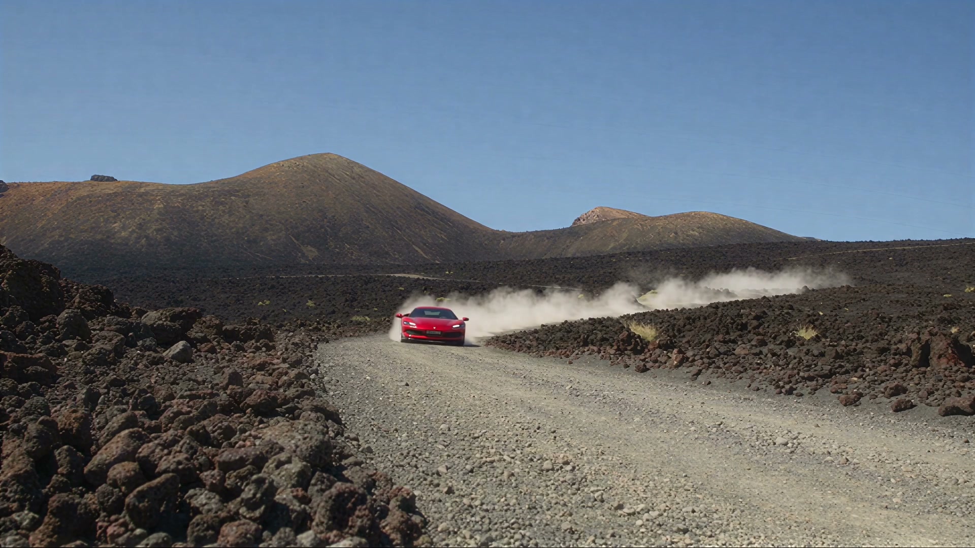 Red Ferrari 296 GTB racing a dusty volcanic track on Mount Etna