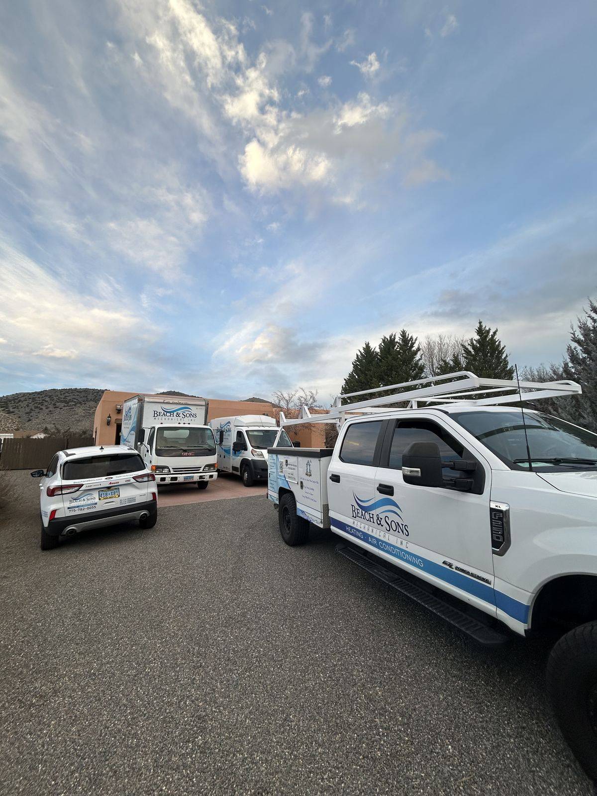Beach and Sons service trucks parked at the end of the day