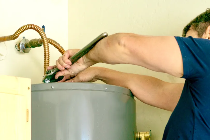 A tech working on a water heater