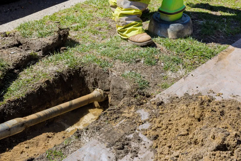 A pipe being dug out of the ground