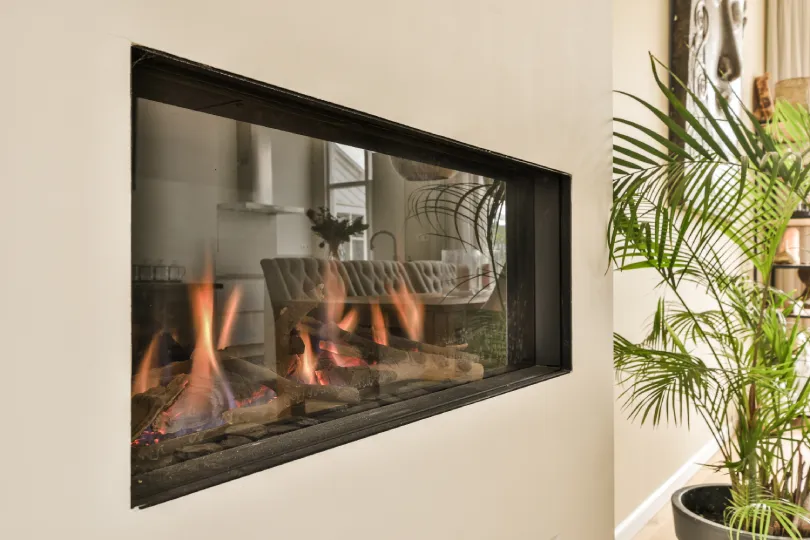 A fireplace using gas in a house.