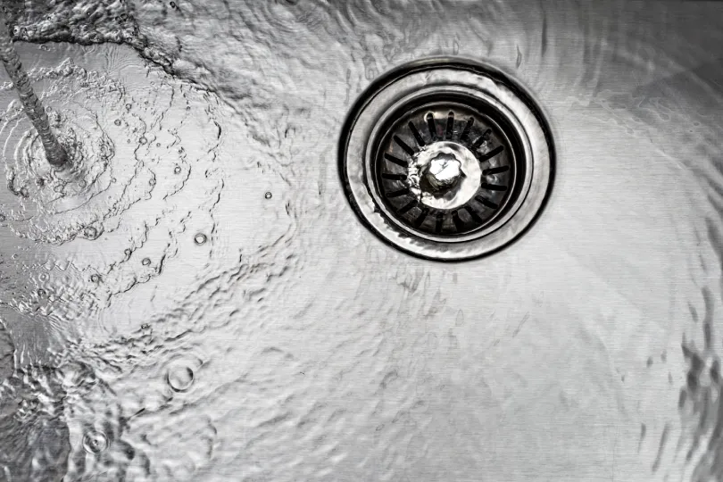 Water flowing down into a drain.
