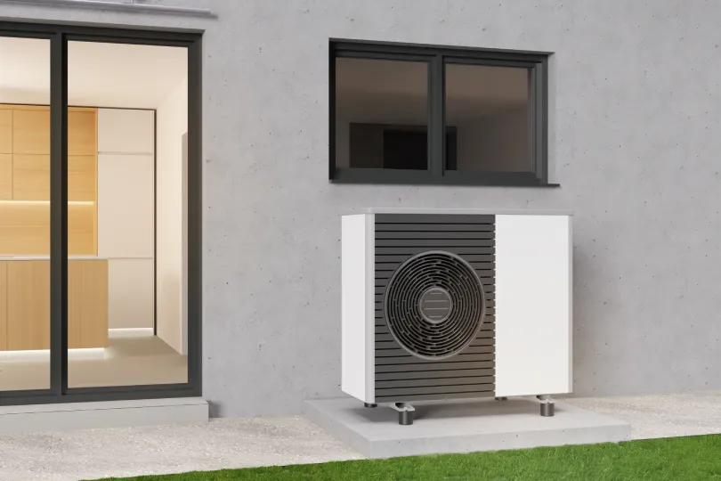 A heat pump outside of a house.