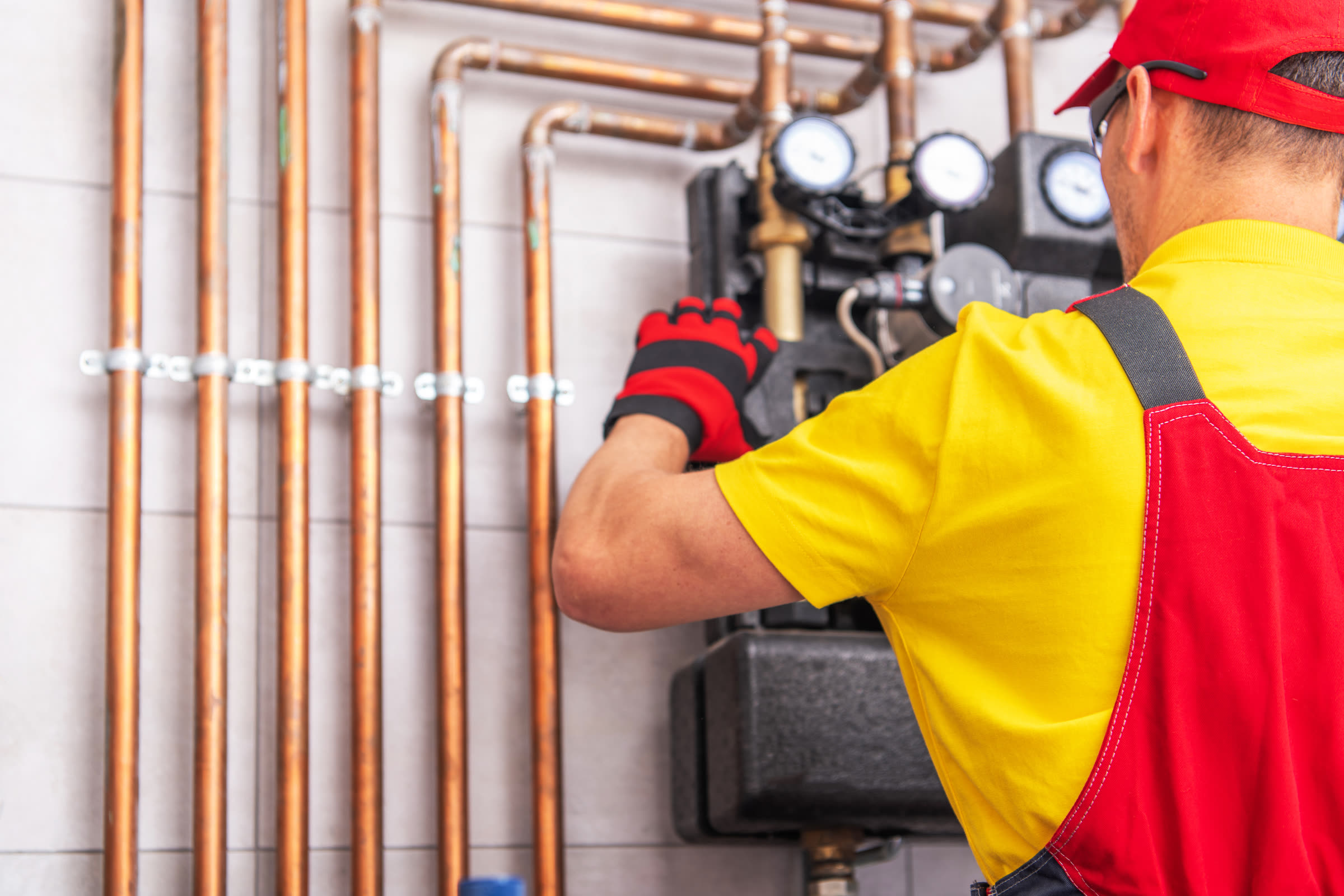 Technician servicing a home heating system