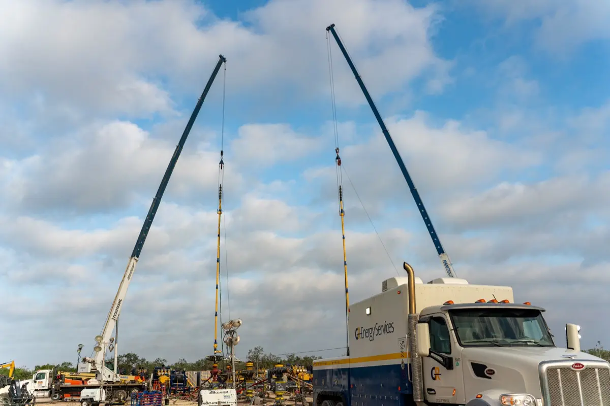 GR wireline units with masts raised on location