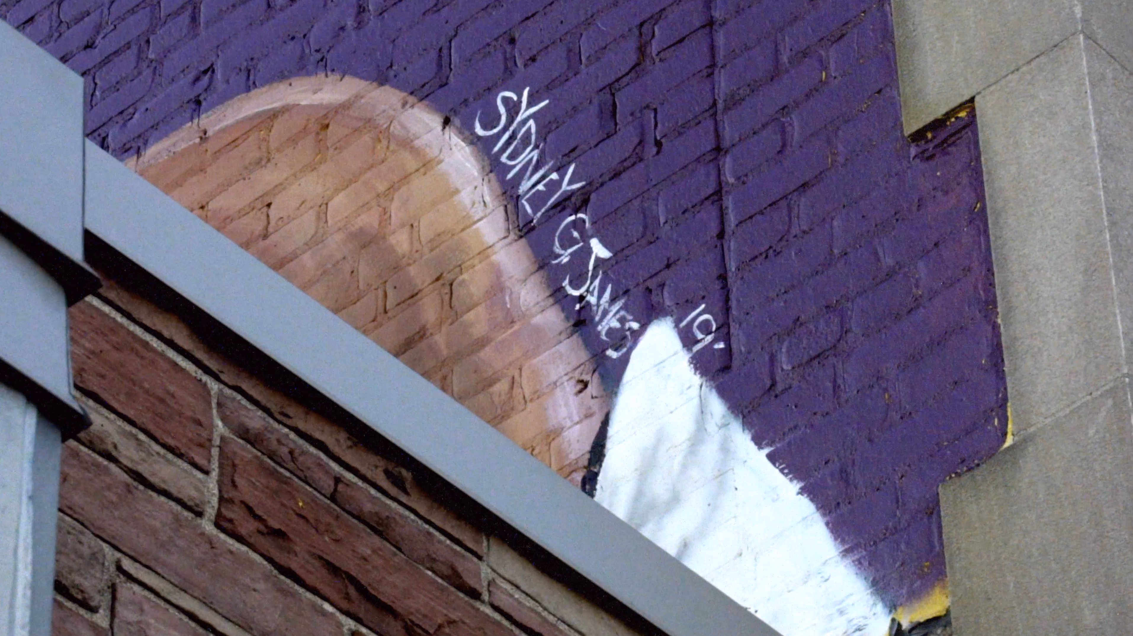 The Steadily Rising mural in progress on a historic Milwaukee building