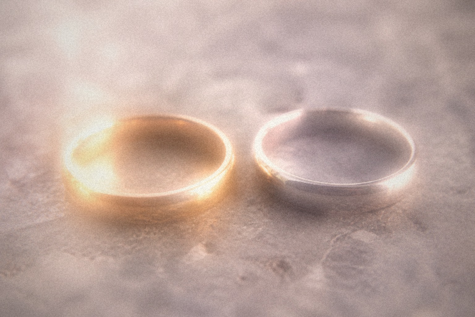 Delicate gold chains heaped in golden light