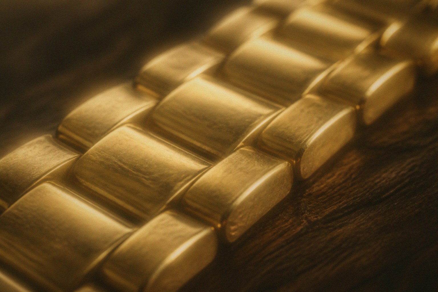 Soft-focus gold ring still on warm linen