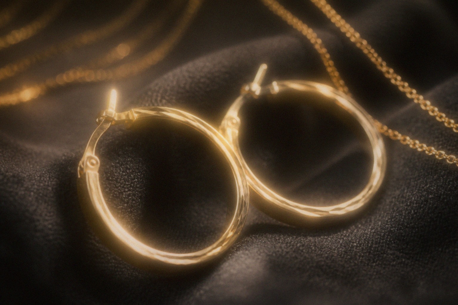Gold wristwatch on a jubilee bracelet in low light