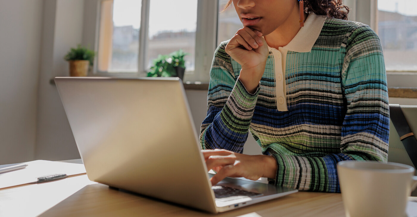A WeShare member reviewing her care options on a laptop at home