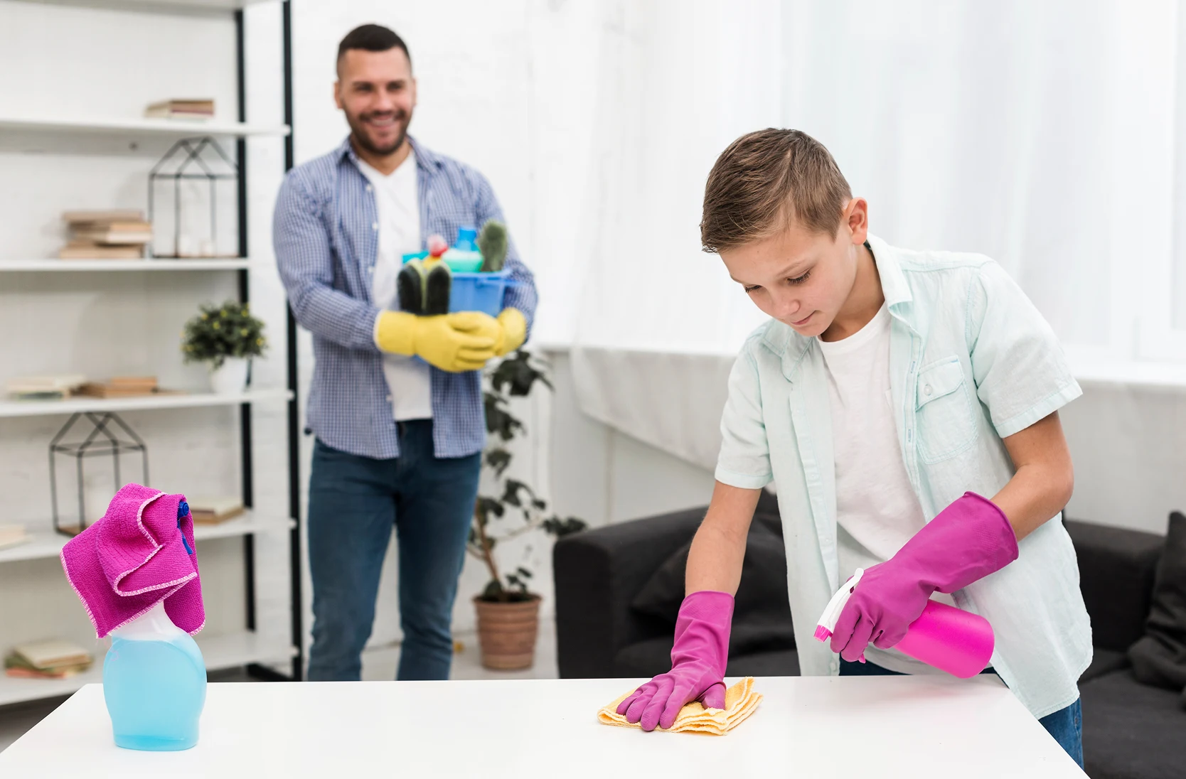 A cleaner and a kid cleaning together