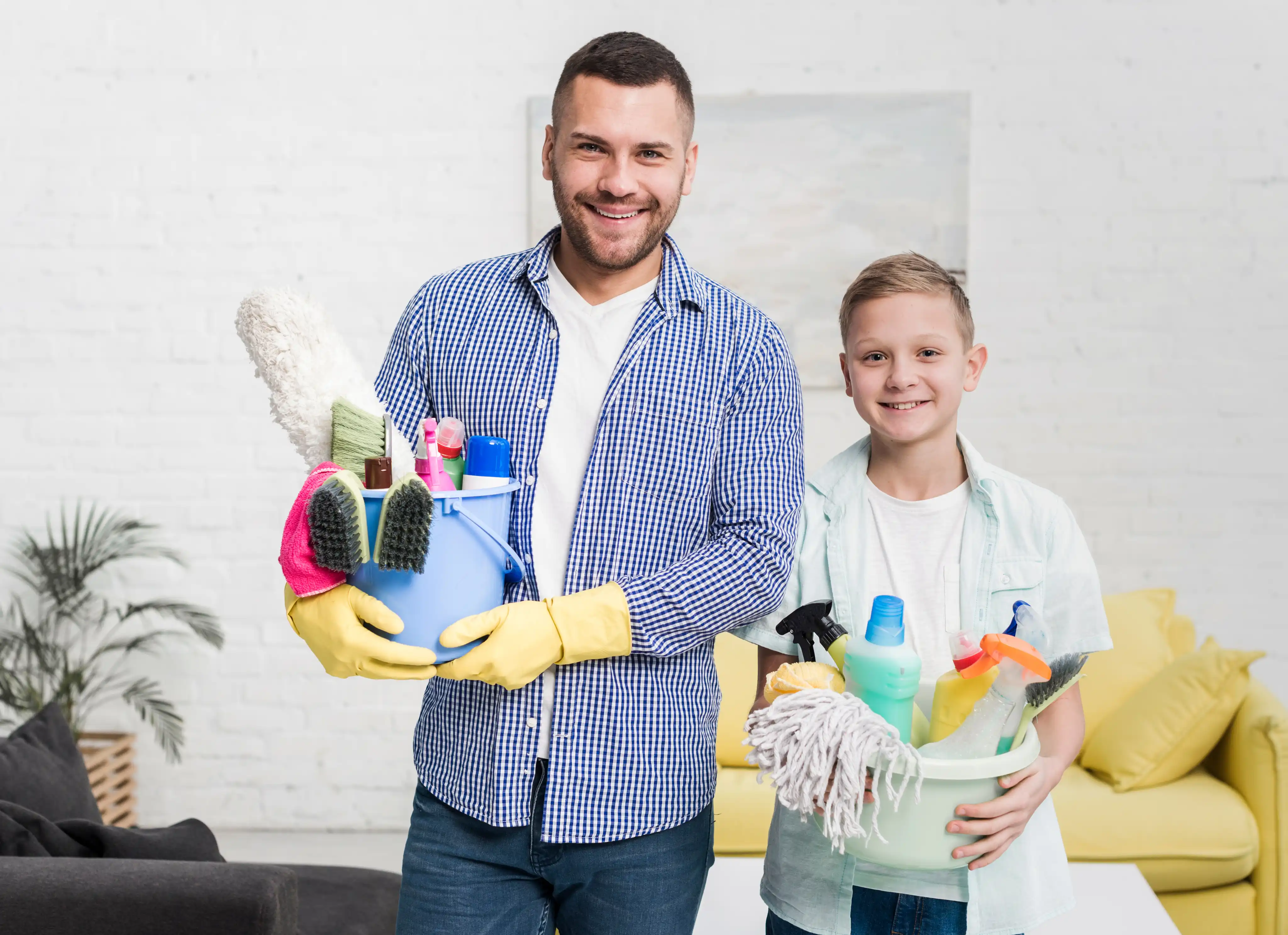 A person and a kid with  some cleaning tools in hands