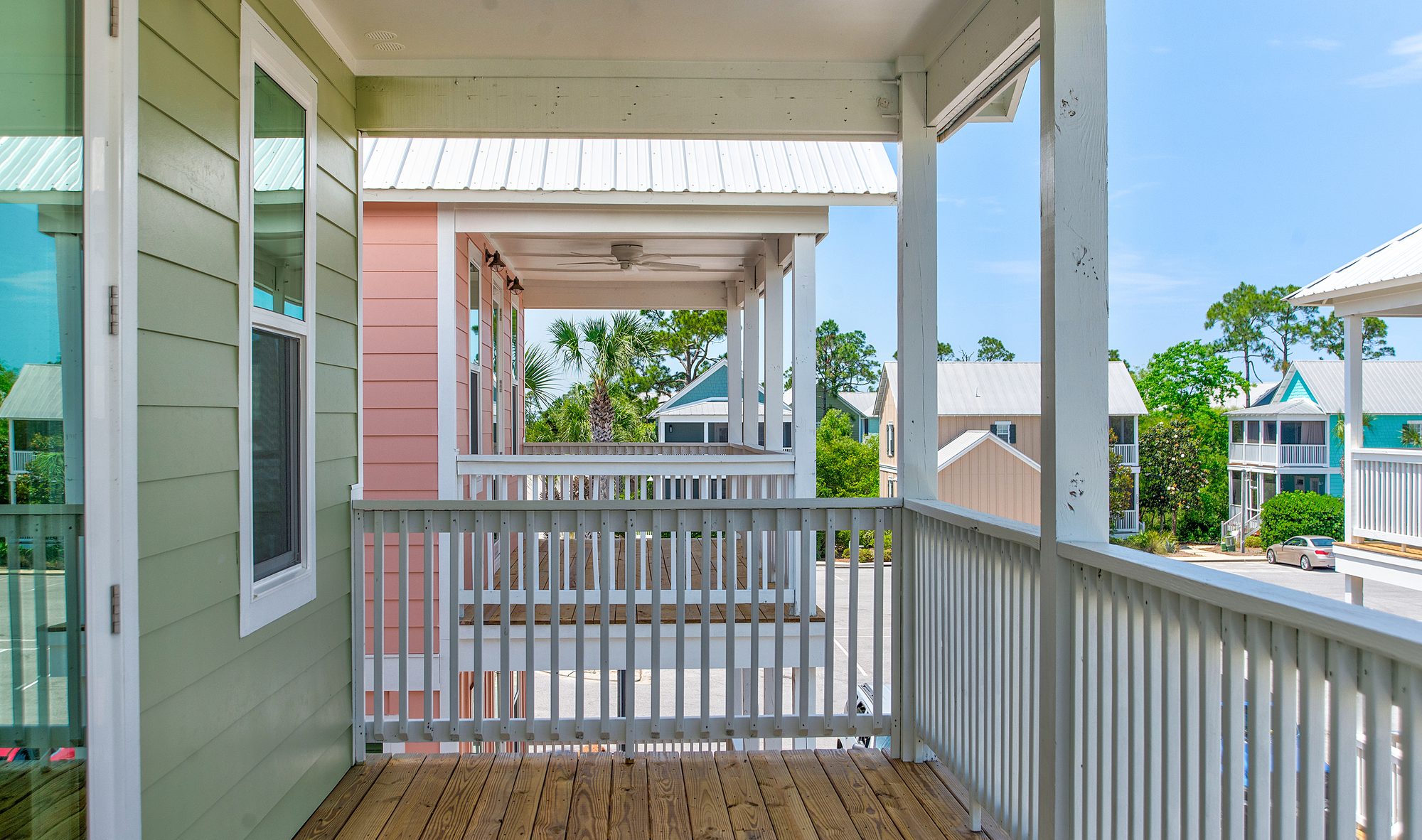Covered porch looking out over the Barefoot Cottages community