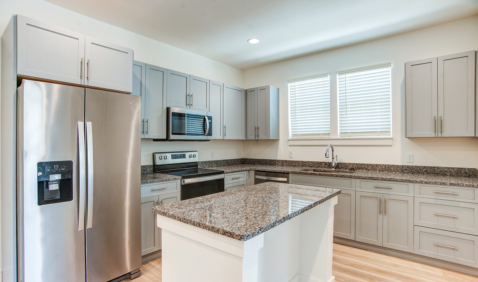 Kitchen and dining area in a four bedroom Barefoot Cottages home