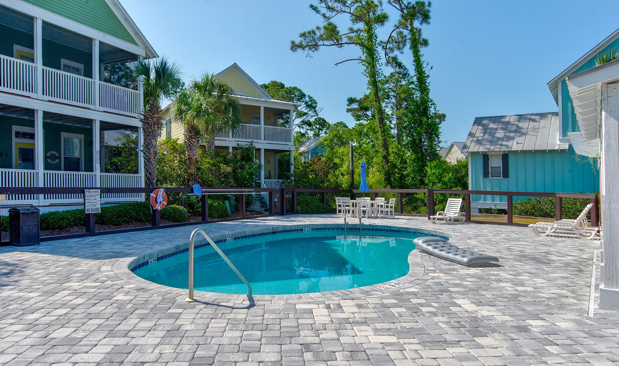 Pool and sun deck at Barefoot Cottages