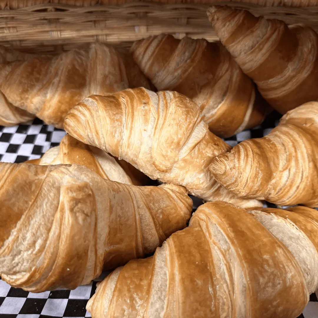 A tray of freshly baked croissants